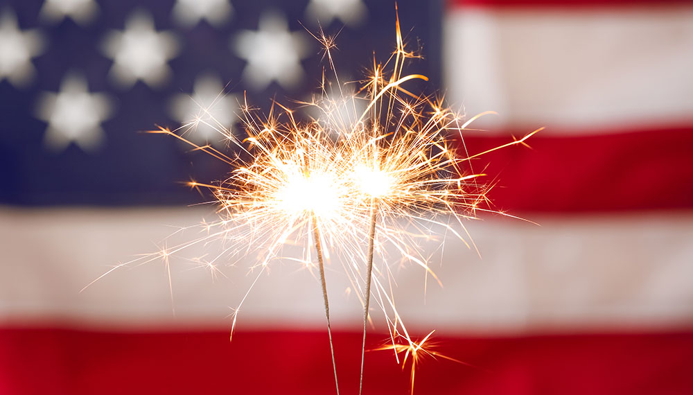 Sparkler in front of American Flag