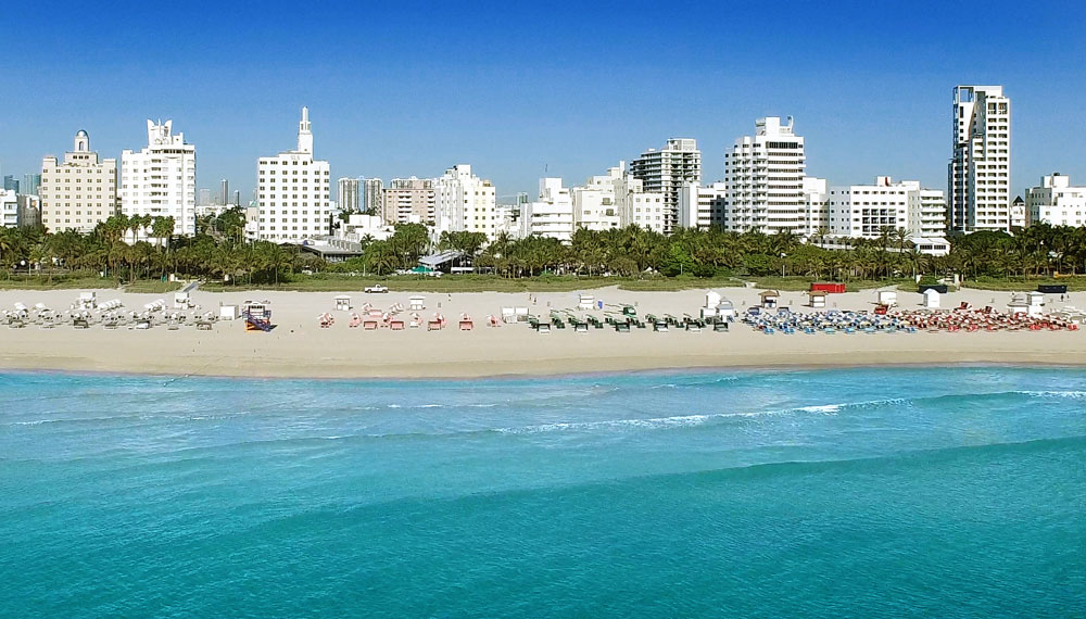 South beach, Sandy beach with seating and umbrellas