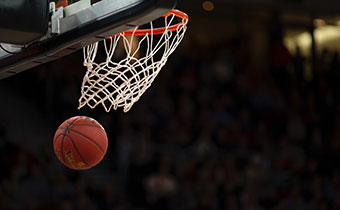 Basketball going through hoop