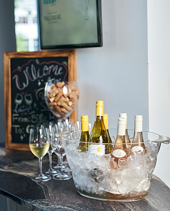 champagne bottles in ice and champagne glasses